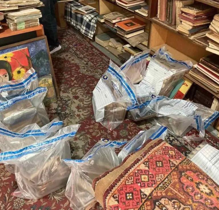 Officers on the scene secured over 150 books in order to establish their provenance